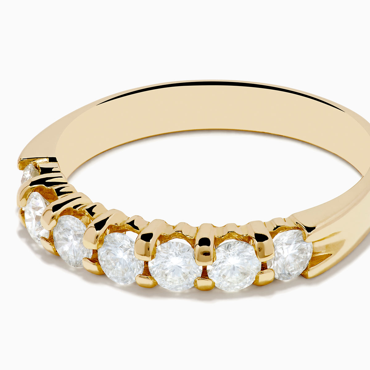 The 14K Yellow Gold 7-Stone Prong Set Diamond Band, 0.75 TCW, showcases a row of seven round diamonds set in yellow gold and displayed against a plain white background.