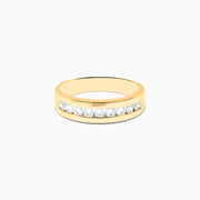 The Mens 14K Yellow Gold 9-Stone Channel Set Diamond Band, 0.75 TCW, showcases nine round diamonds in a horizontal channel across the front, displayed on a plain white background.