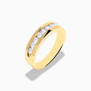The Mens 14K Yellow Gold 9-Stone Channel Set Diamond Band, 0.75 TCW, showcases nine round diamonds in a horizontal channel across the front, displayed on a plain white background.