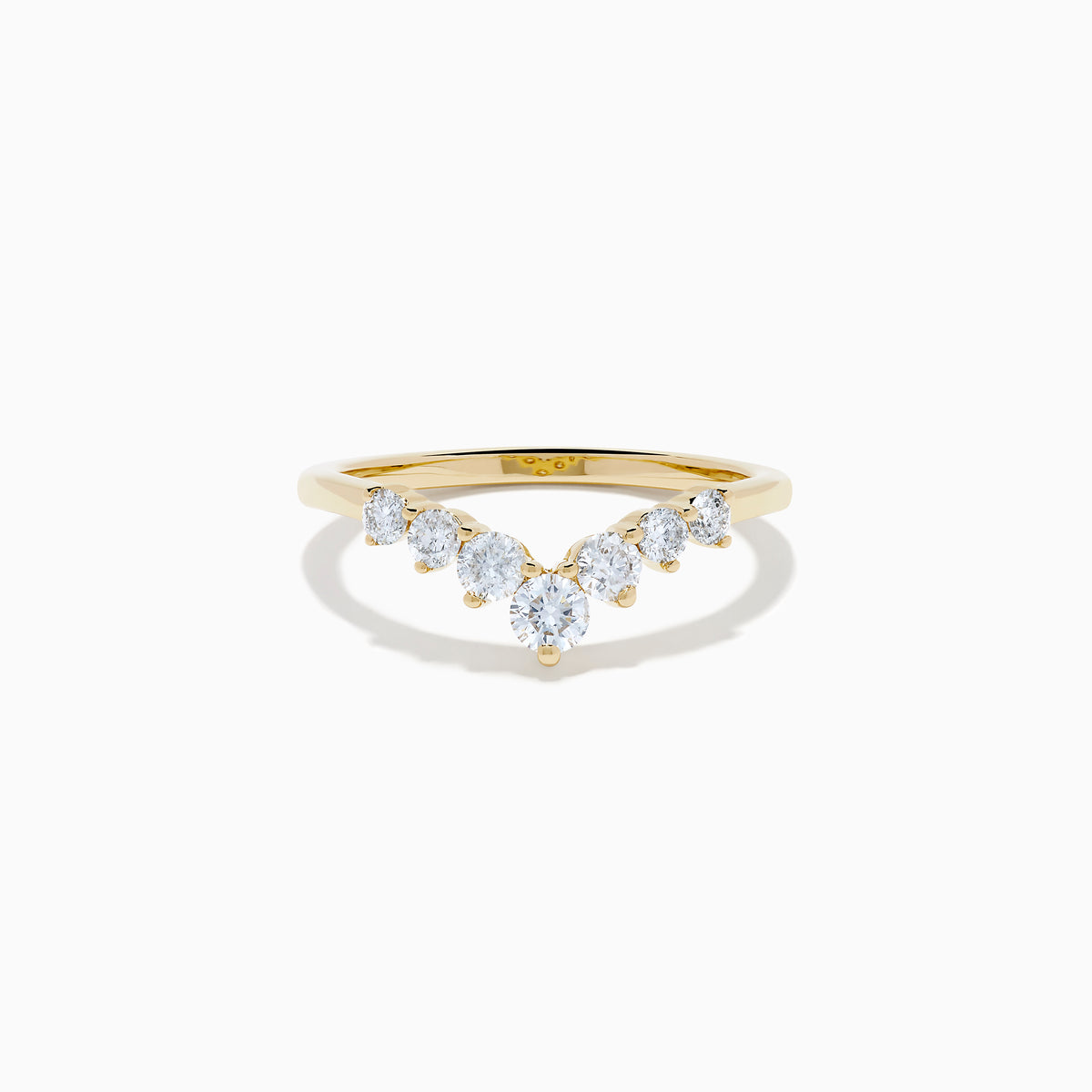 The D’Oro 14K Yellow Gold Diamond Curved Wedding Band features a chevron design with seven round white diamonds of varying sizes set along the pointed curve, shown against a white background.