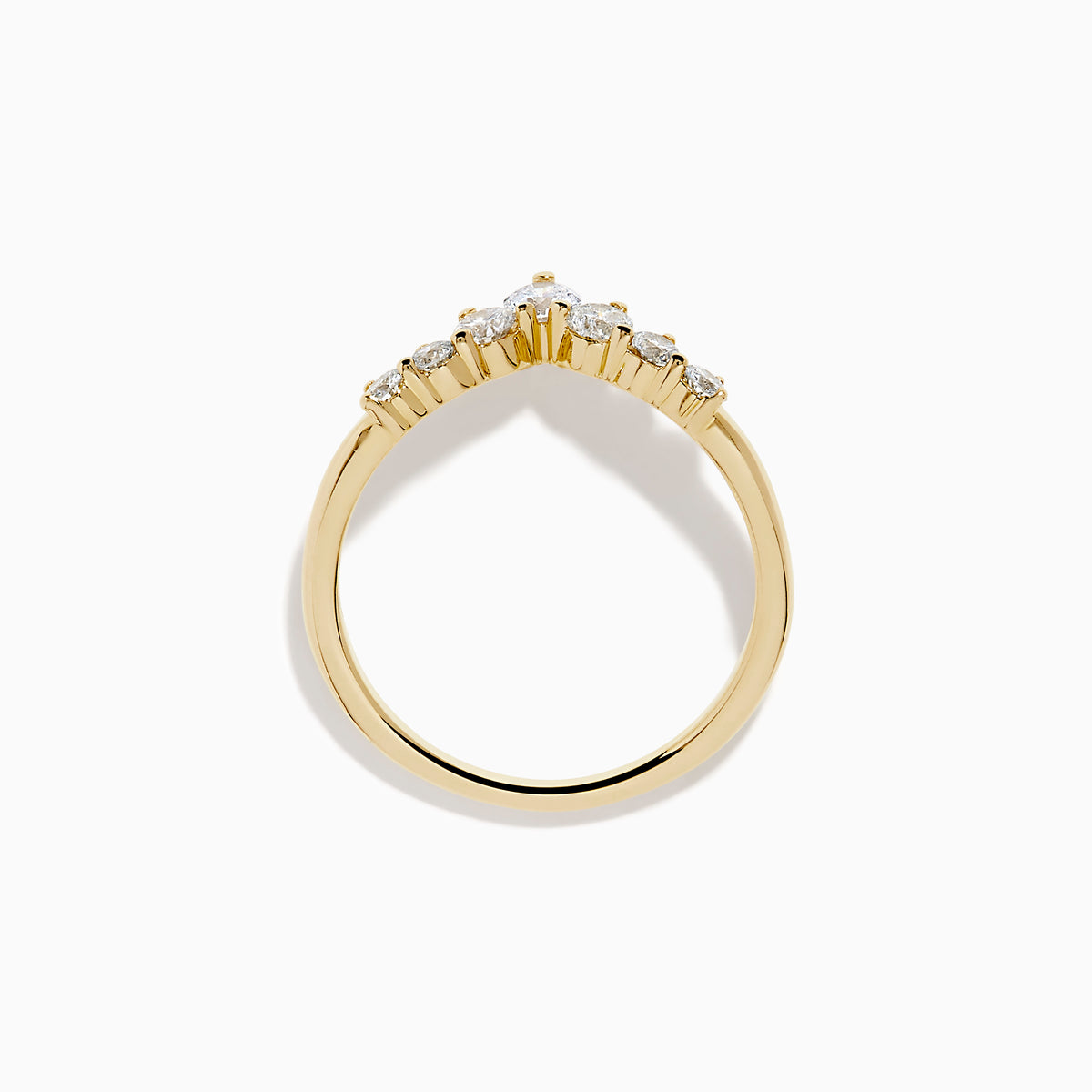 The D’Oro 14K Yellow Gold Diamond Curved Wedding Band features a chevron design with seven round white diamonds of varying sizes set along the pointed curve, shown against a white background.