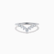 The Classique 14K White Gold Diamond Wedding Band showcases a delicate V-shaped design with sparkling round diamonds elegantly set along the band’s curve.