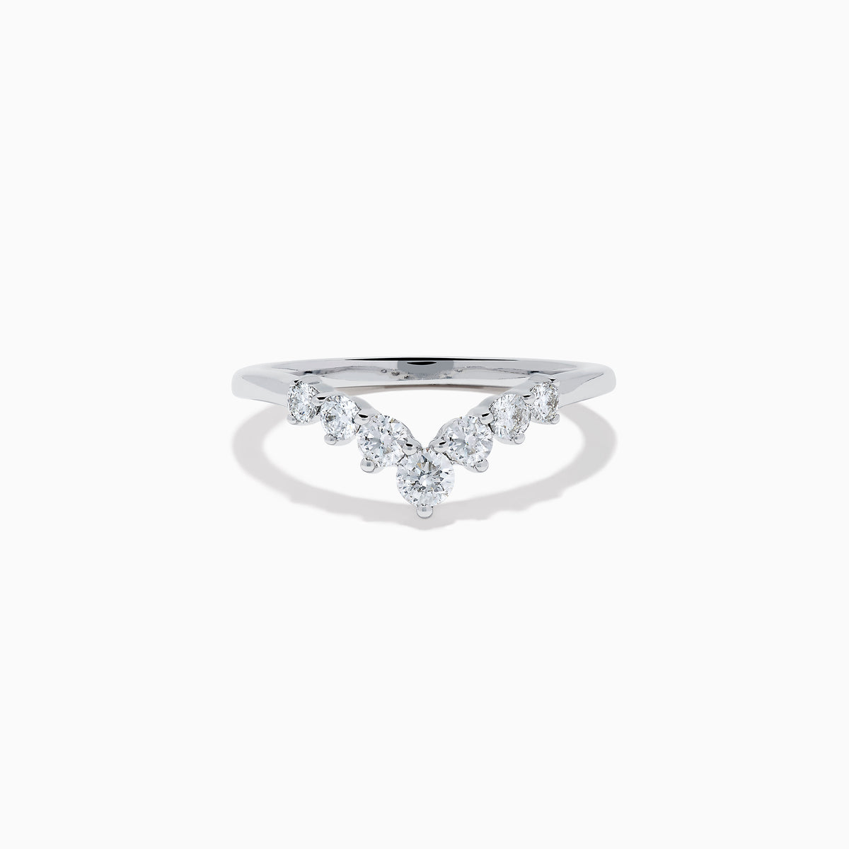 The Classique 14K White Gold Diamond Wedding Band showcases a delicate V-shaped design with sparkling round diamonds elegantly set along the band’s curve.