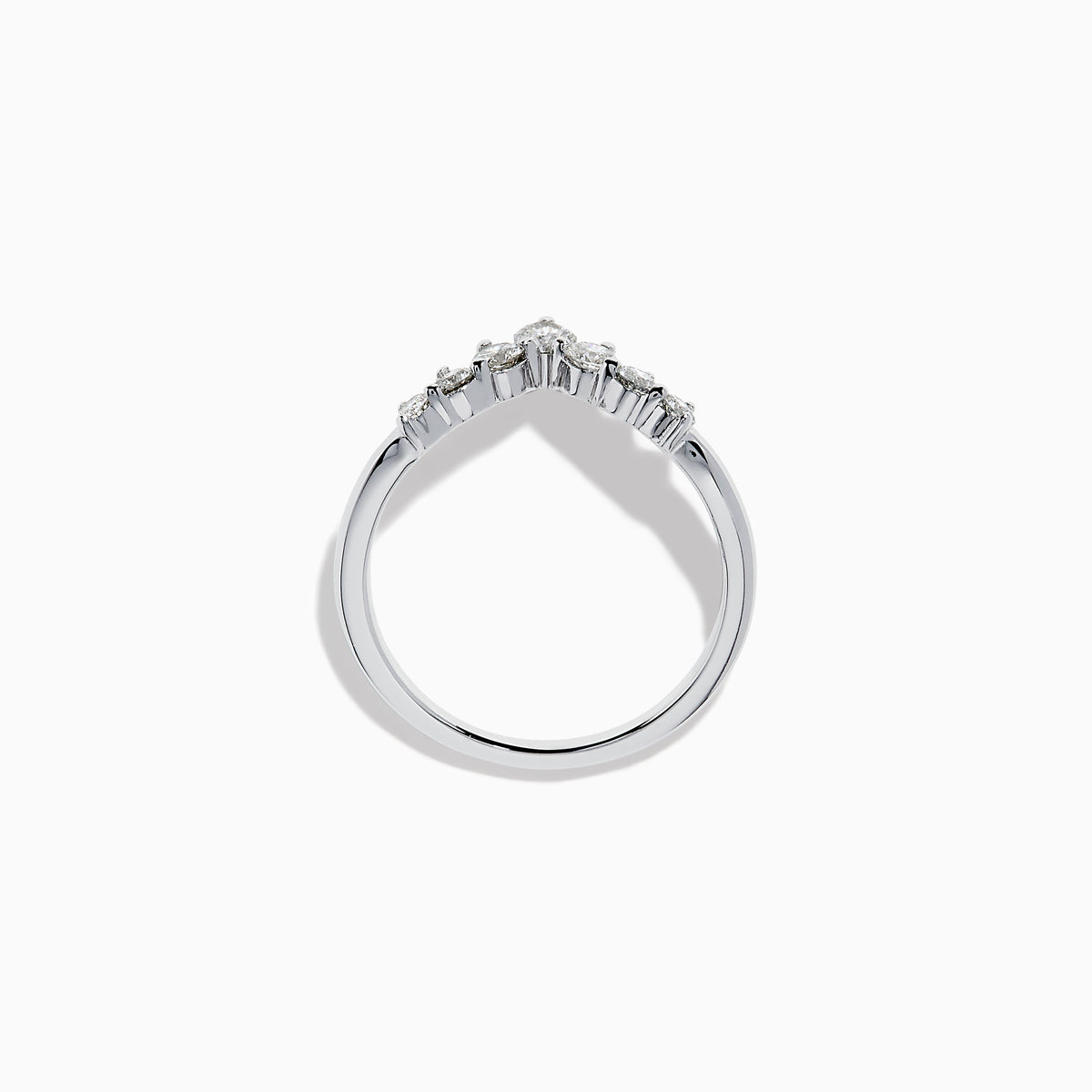 The Classique 14K White Gold Diamond Wedding Band showcases a delicate V-shaped design with sparkling round diamonds elegantly set along the band’s curve.