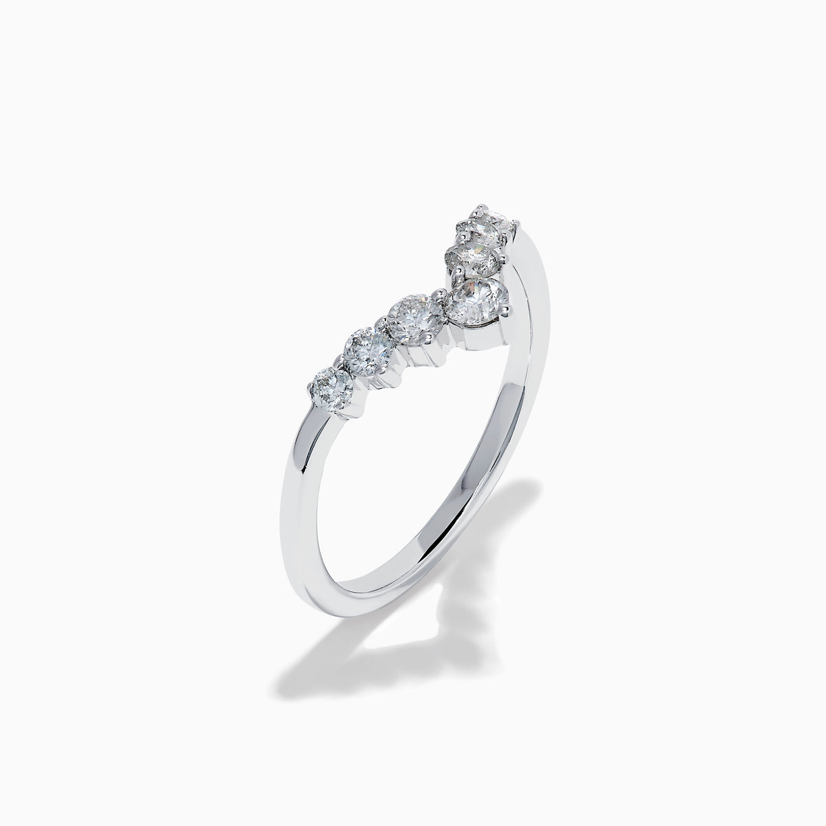 The Classique 14K White Gold Diamond Wedding Band showcases a delicate V-shaped design with sparkling round diamonds elegantly set along the band’s curve.