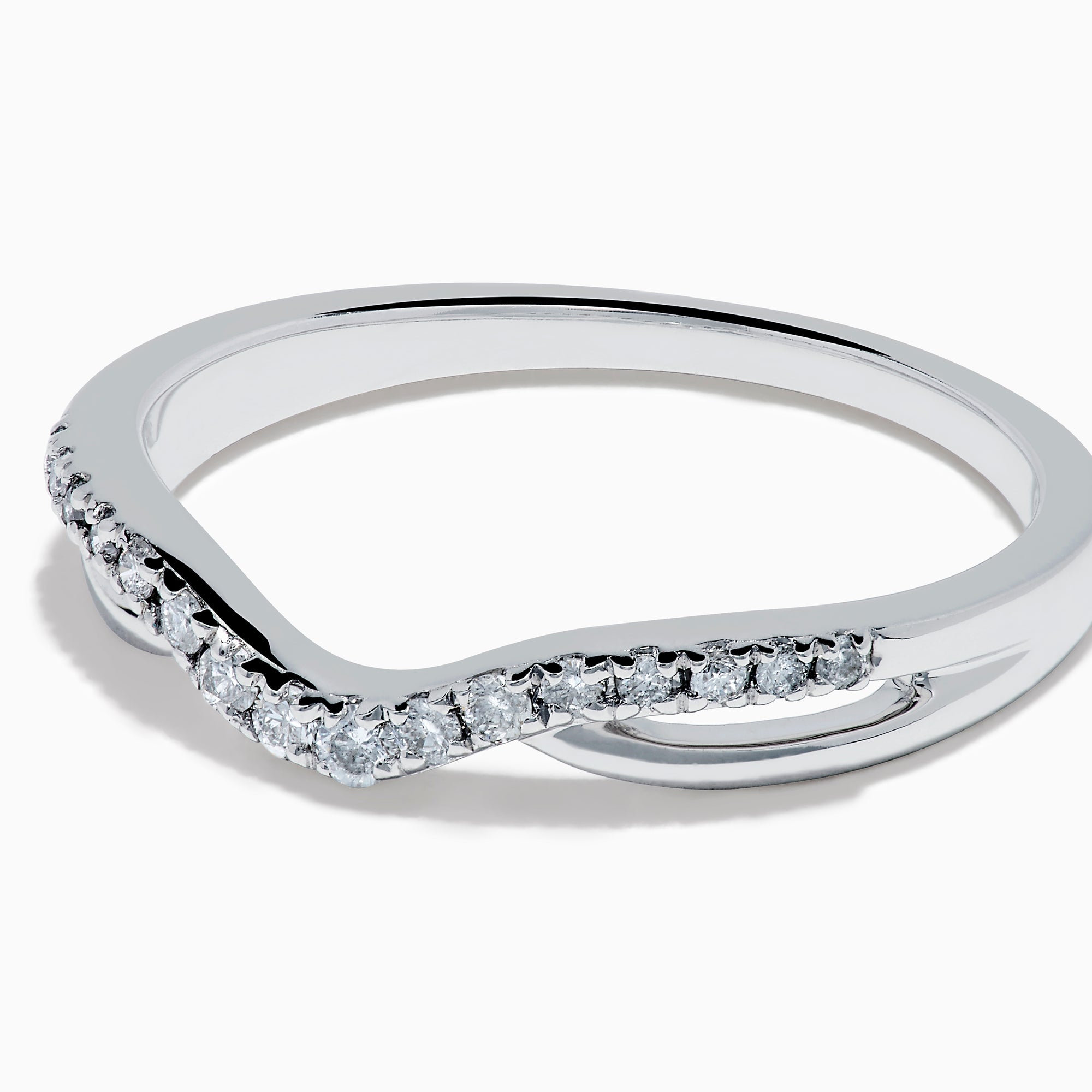 The Classique 14K White Gold Diamond Wedding Band features a subtle chevron shape with small round diamonds along the curved top and a sleek, polished, minimalist design.