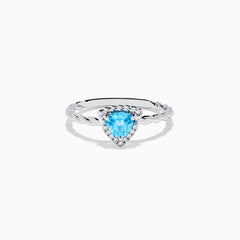The 925 Sterling Silver Blue Topaz and Diamond Ring features a twisted band, a heart-shaped blue topaz center, and sparkling diamonds, shown against a plain white background.