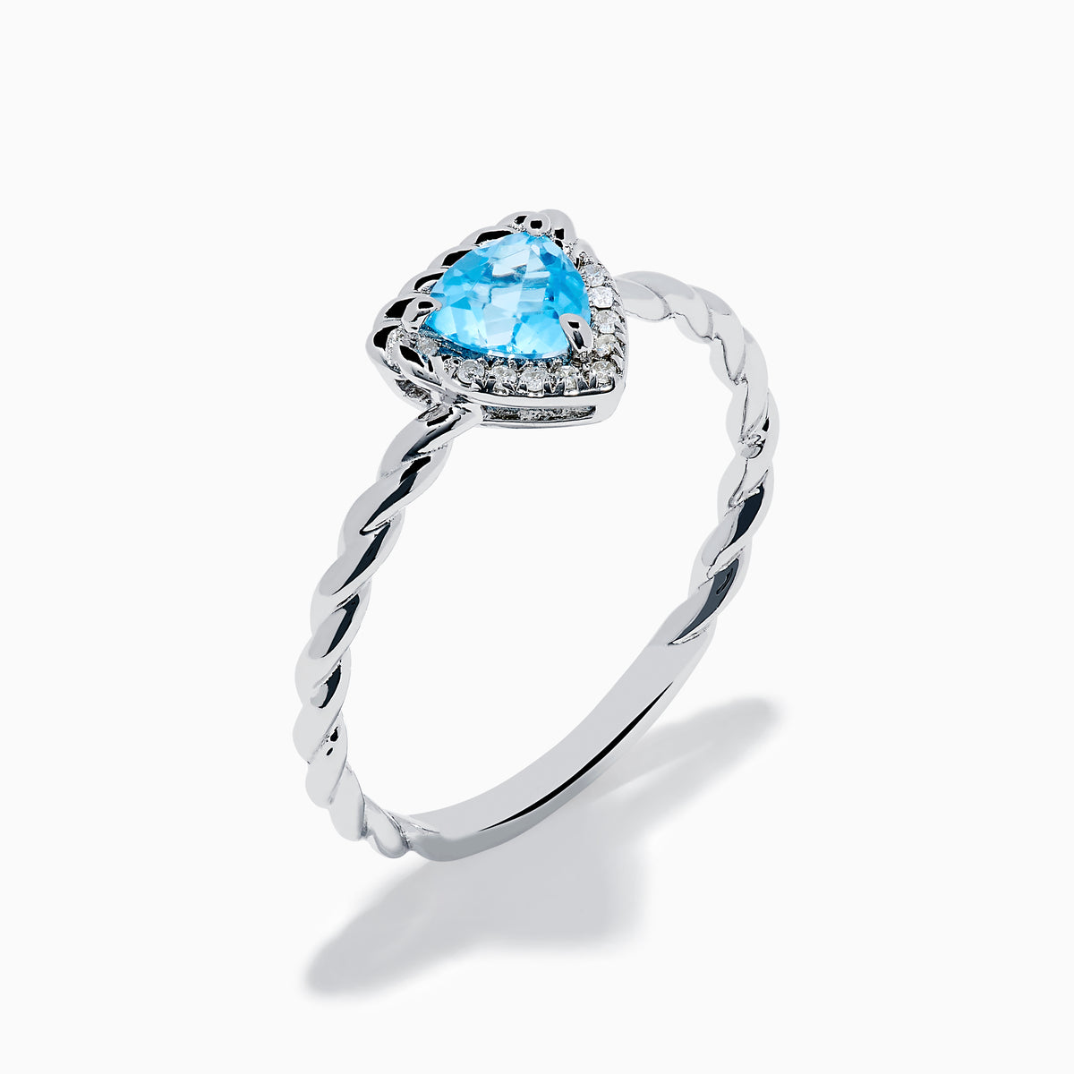 The 925 Sterling Silver Blue Topaz and Diamond Ring features a twisted band, a heart-shaped blue topaz center, and sparkling diamonds, shown against a plain white background.