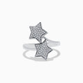 The Novelty 925 Sterling Silver and Diamond Star Ring features two star-shaped settings with sparkling stones, crafted from sterling silver and shown against a white background.