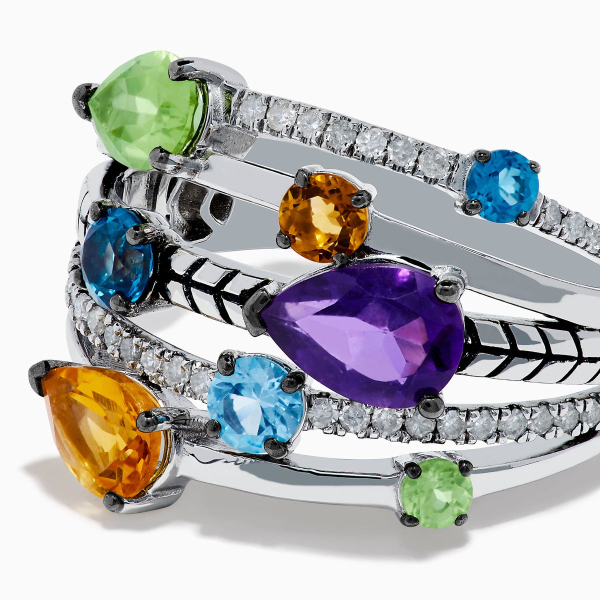 The Mosaic 925 Sterling Silver Multi Gemstone and Diamond Ring features pear-shaped purple, orange, green, and blue stones with round diamond accents and geometric engraving across multiple bands.