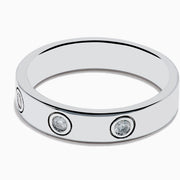 The 925 Sterling Silver Diamond Ring features three evenly spaced round diamonds set into a sleek silver band, shown against a plain white background.