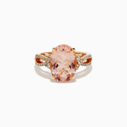 The 14K Rose Gold Oval Solitaire Morganite and Diamond Ring features a large pink morganite centerpiece, accented by two rows of sparkling diamonds along the split shank rose gold band.