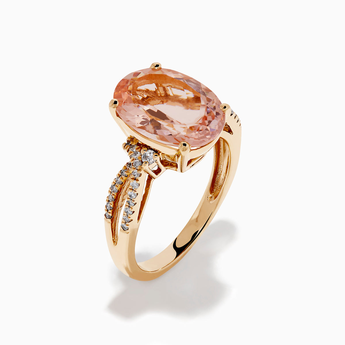 The 14K Rose Gold Oval Solitaire Morganite and Diamond Ring features a large pink morganite centerpiece, accented by two rows of sparkling diamonds along the split shank rose gold band.