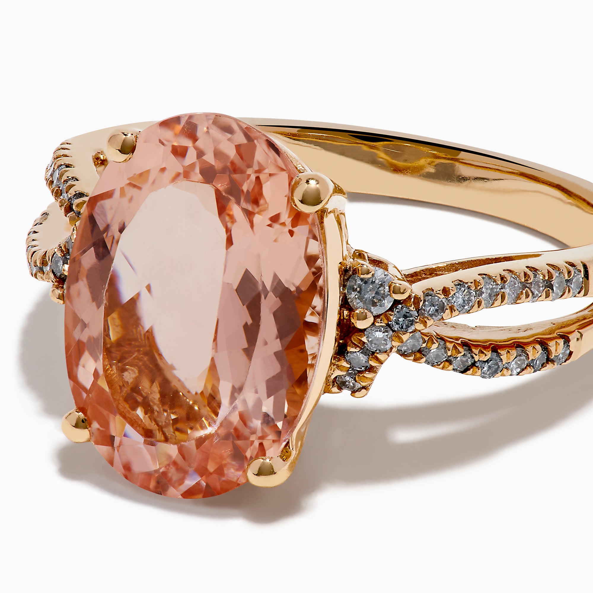 The 14K Rose Gold Oval Solitaire Morganite and Diamond Ring features a large pink morganite centerpiece, accented by two rows of sparkling diamonds along the split shank rose gold band.