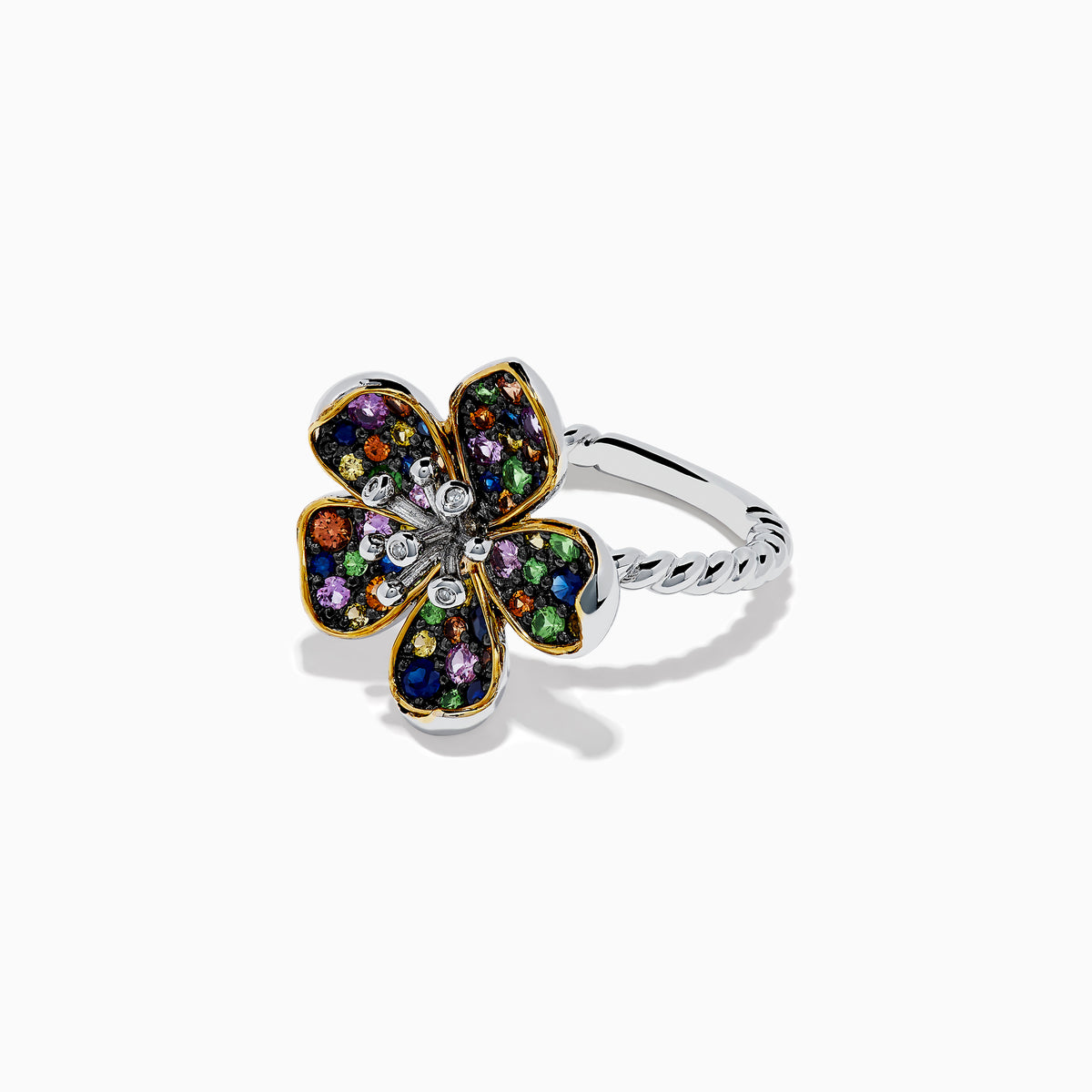 The Splash Sterling Silver Diamond and Multi Sapphires Flower Ring features a clover-shaped design with gold-outlined petals, sapphires, multicolored gemstones, and a sterling silver band, shown on a white background.