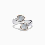 The 925 Sterling Silver & 14K Rose Gold Diamond Heart Bypass Ring features a ribbed band with two open ends, each accented by a heart-shaped cluster of small diamonds outlined in rose gold. Shown on a white background.