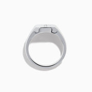 The 925 Sterling Silver Diamond Cross Ring features a flat, oval top with a raised diamond cross set with small white stones against a black background, creating a simple and elegant design.