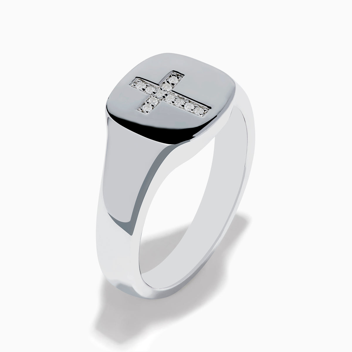 The 925 Sterling Silver Diamond Cross Ring features a flat, oval top with a raised diamond cross set with small white stones against a black background, creating a simple and elegant design.