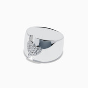 The 925 Sterling Silver Diamond Heart Wide Band Ring showcases a raised heart encrusted with sparkling diamonds at the center, set on a plain sterling silver band.