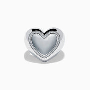 The 925 Sterling Silver Diamond Bubble Heart Ring features a smooth, reflective heart shape bordered by sparkling diamond-like gems, set against a white background.