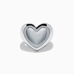 The 925 Sterling Silver Diamond Bubble Heart Ring features a smooth, reflective heart shape bordered by sparkling diamond-like gems, set against a white background.