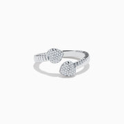 The 925 Sterling Silver Diamond Bypass Heart Ring features two heart-shaped ends encrusted with sparkling white gemstones, elegantly set against a plain white background.
