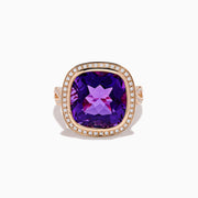 The 14K Rose Gold Amethyst and Diamond Cocktail Ring features a cushion-cut amethyst center, encircled by sparkling round diamonds, all set in elegant rose gold against a white background.