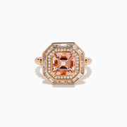 The 14K Rose Gold Morganite and Diamond Geometric Cocktail Ring showcases a large square peach morganite center, framed by two rows of sparkling white diamonds in a geometric halo, set against a white background.