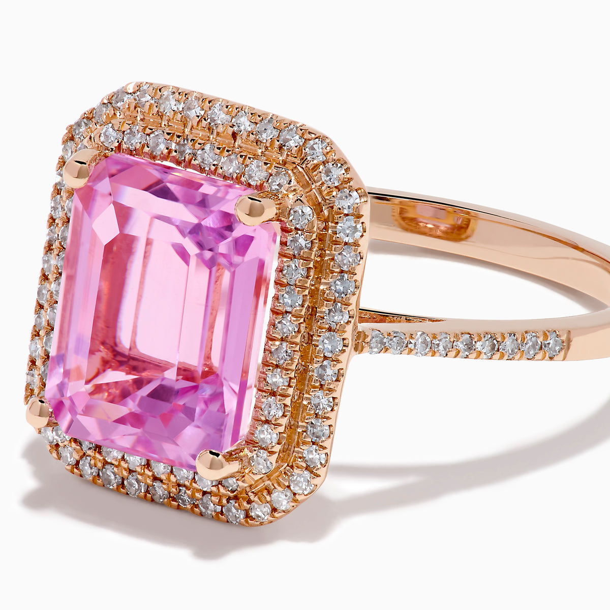 The 14K Rose Gold Kunzite and Diamond Double Halo Ring features a rectangular pink Kunzite, framed by two rows of diamonds on a rose gold band, presented against a plain white background.