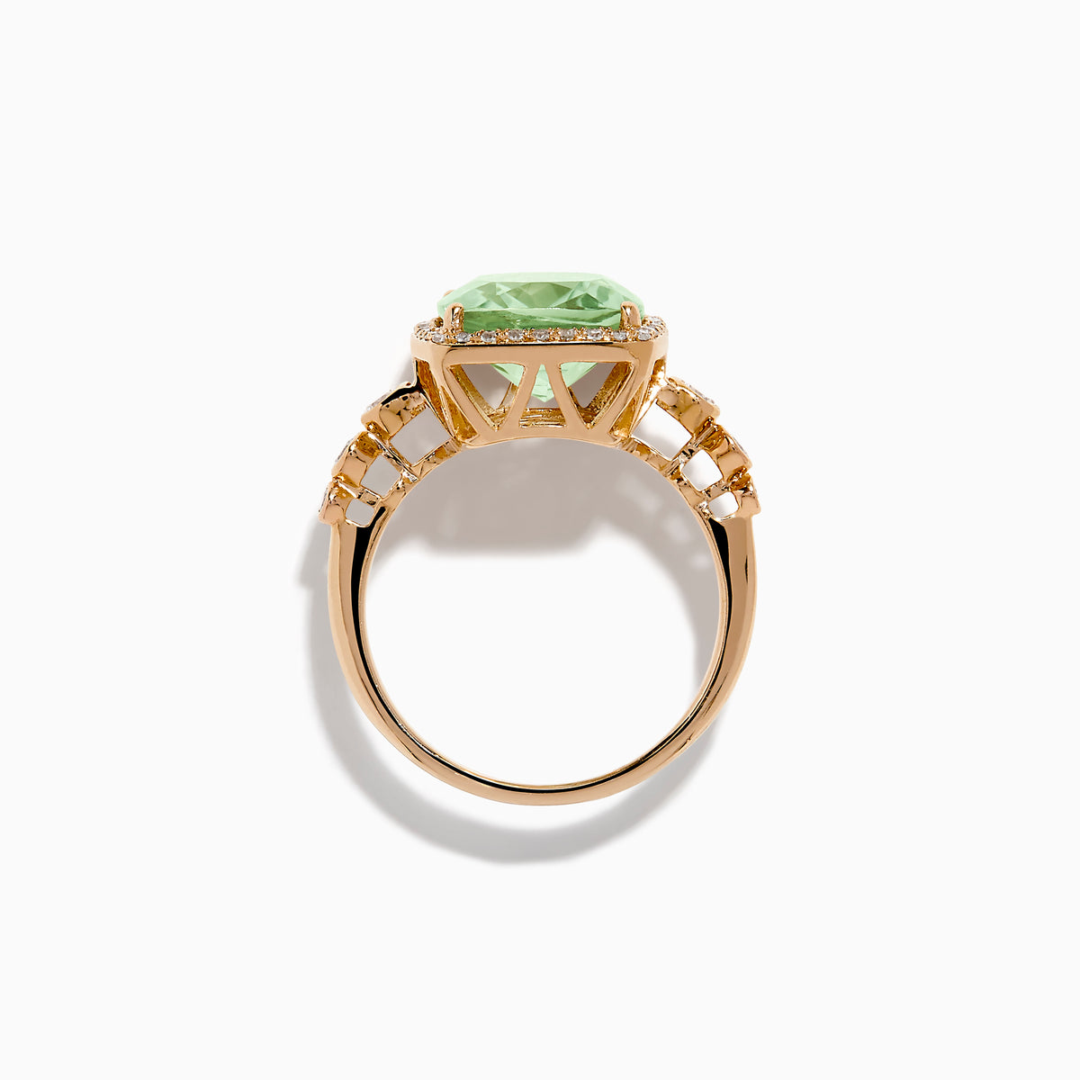 The 14K Rose Gold Green Amethyst and Diamond Halo Cocktail Ring showcases a rectangular light green amethyst center, framed by a sparkling diamond halo with round diamonds accenting the band.