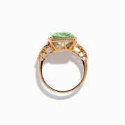 The 14K Rose Gold Green Amethyst and Diamond Halo Cocktail Ring showcases a rectangular light green amethyst center, framed by a sparkling diamond halo with round diamonds accenting the band.