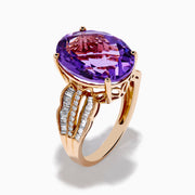 The 14K Rose Gold Purple Amethyst and Diamond Cocktail Ring features a large oval purple amethyst center, accented by three rows of small rectangular diamonds on each side, set in rose gold.