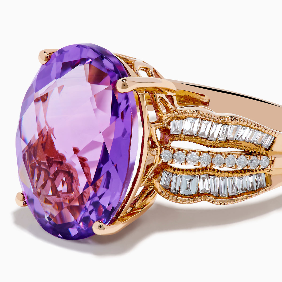 The 14K Rose Gold Purple Amethyst and Diamond Cocktail Ring features a large oval purple amethyst center, accented by three rows of small rectangular diamonds on each side, set in rose gold.