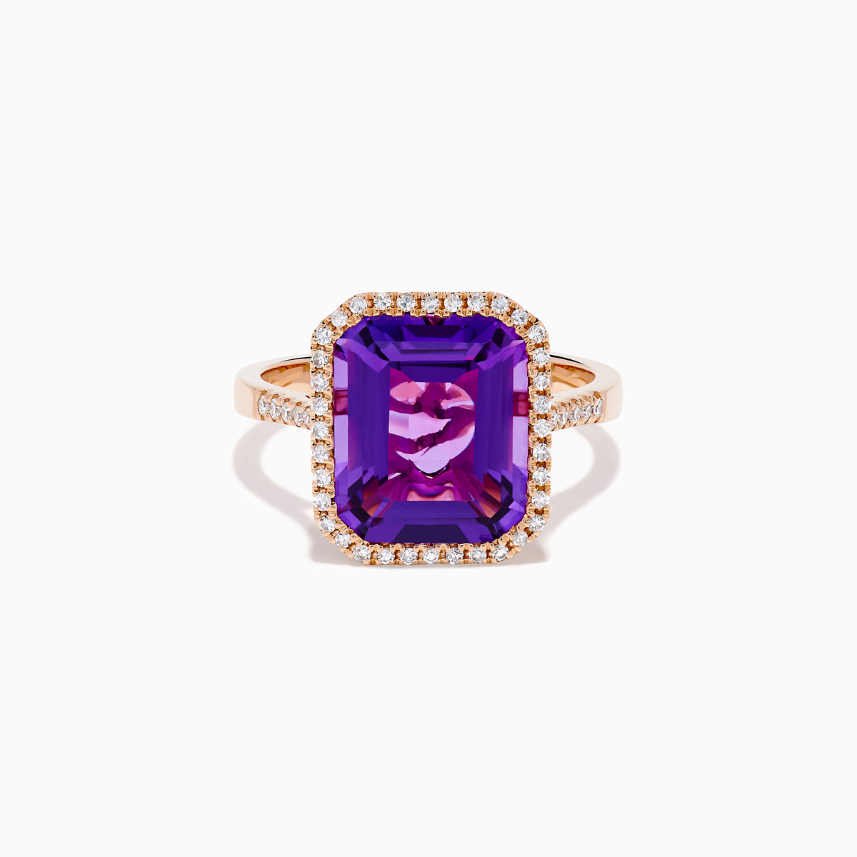 The 14K Rose Gold Amethyst and Diamond Halo Ring features a large, emerald-cut purple amethyst at the center, encircled by sparkling diamonds, and is showcased on a plain white background.