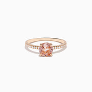 The Blush 14K Rose Gold Morganite and Diamond Ring features a large oval peach morganite center and sparkling diamonds along the band, shown on a white background.