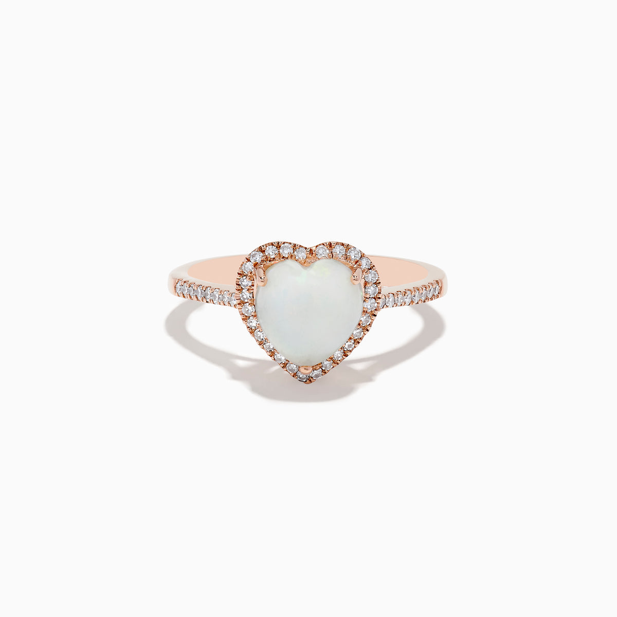 The Aurora 14K Rose Gold Diamond and Opal Heart Ring features a heart-shaped opal center, sparkling diamonds encircling it, and additional diamonds set along the elegant rose gold band.