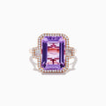 The 14K Rose Gold Pink Amethyst and Diamond Cocktail Ring features a large rectangular pink amethyst, accented by round diamonds on each side, displayed on a white background.