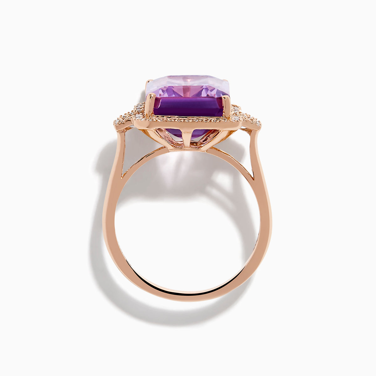 The 14K Rose Gold Pink Amethyst and Diamond Cocktail Ring features a large rectangular pink amethyst, accented by round diamonds on each side, displayed on a white background.