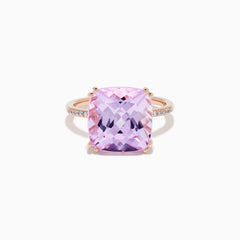 The 14K Rose Gold Kunzite and Diamond Ring features a striking cushion-cut kunzite gemstone at the center, accented with sparkling diamonds along the band.