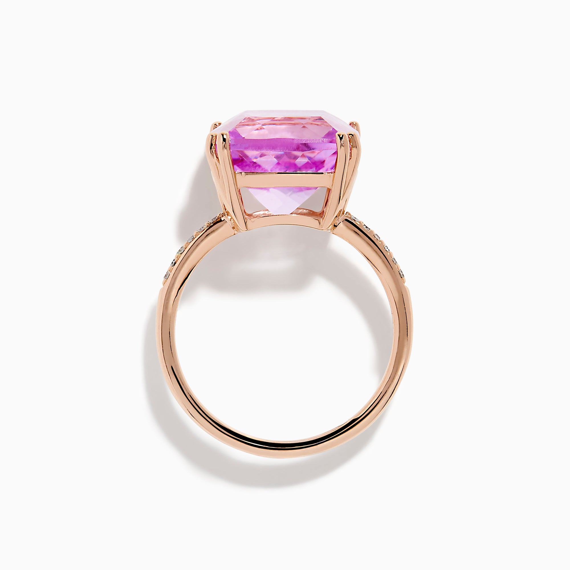 The 14K Rose Gold Kunzite and Diamond Ring features a striking cushion-cut kunzite gemstone at the center, accented with sparkling diamonds along the band.