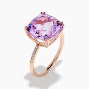 The 14K Rose Gold Kunzite and Diamond Ring features a striking cushion-cut kunzite gemstone at the center, accented with sparkling diamonds along the band.