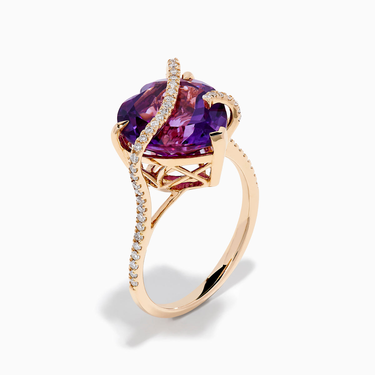 The 14K Rose Gold Amethyst and Diamond Heart Ring features a large heart-shaped amethyst set in rose gold, accented by a diamond-encrusted band, shown on a white background.