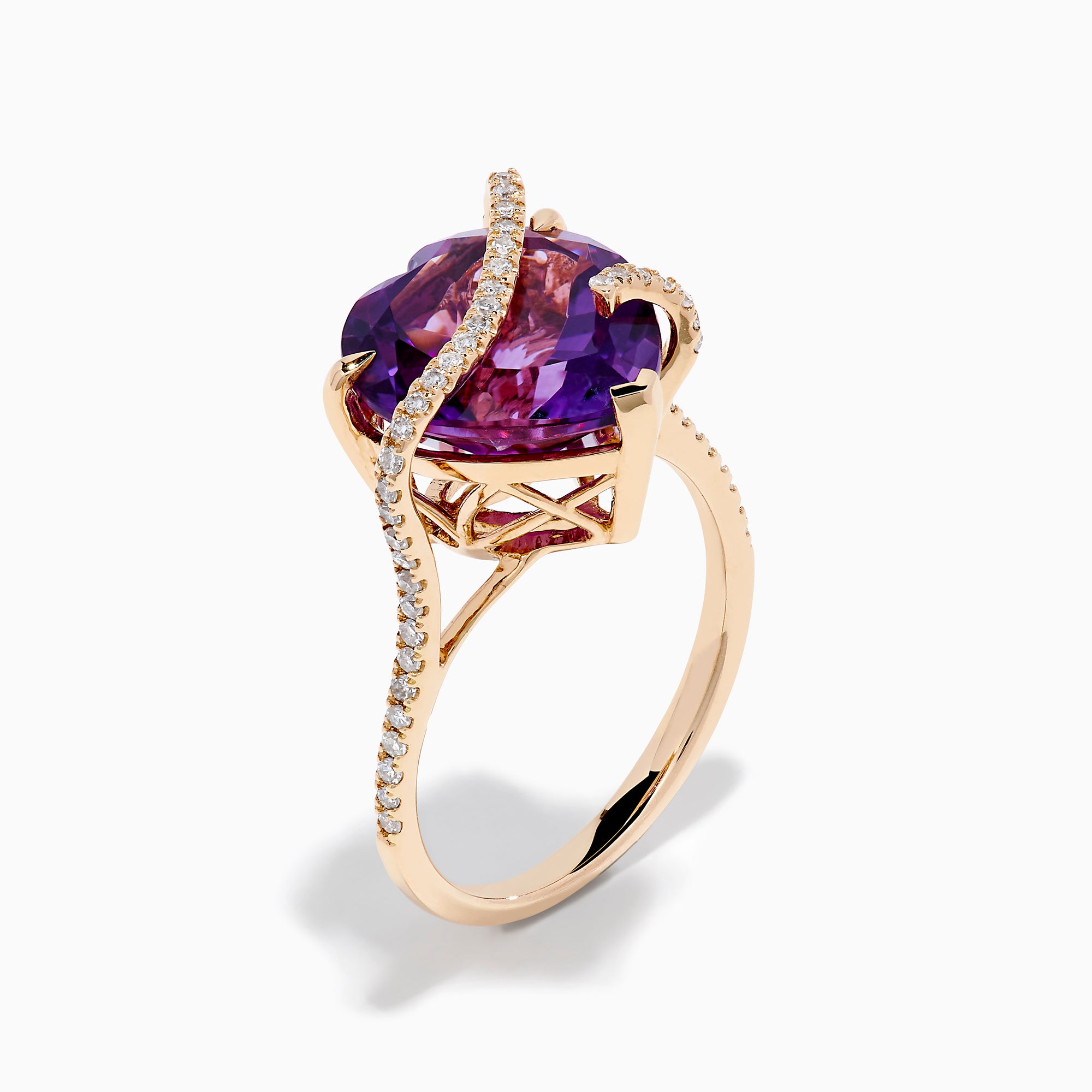 The 14K Rose Gold Amethyst and Diamond Heart Ring features a large heart-shaped amethyst set in rose gold, accented by a diamond-encrusted band, shown on a white background.