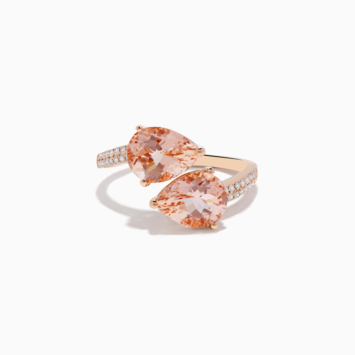 The Blush 14K Rose Gold Morganite and Diamond Bypass Ring showcases two large pear-shaped peach morganites and a diamond-accented band, set in rose gold against a white background.