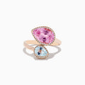The 14K Rose Gold Kunzite and Aquamarine Diamond Toi et Moi Ring features a pear-shaped kunzite and a light blue aquamarine set diagonally, each surrounded by sparkling diamonds on an elegant rose gold band.