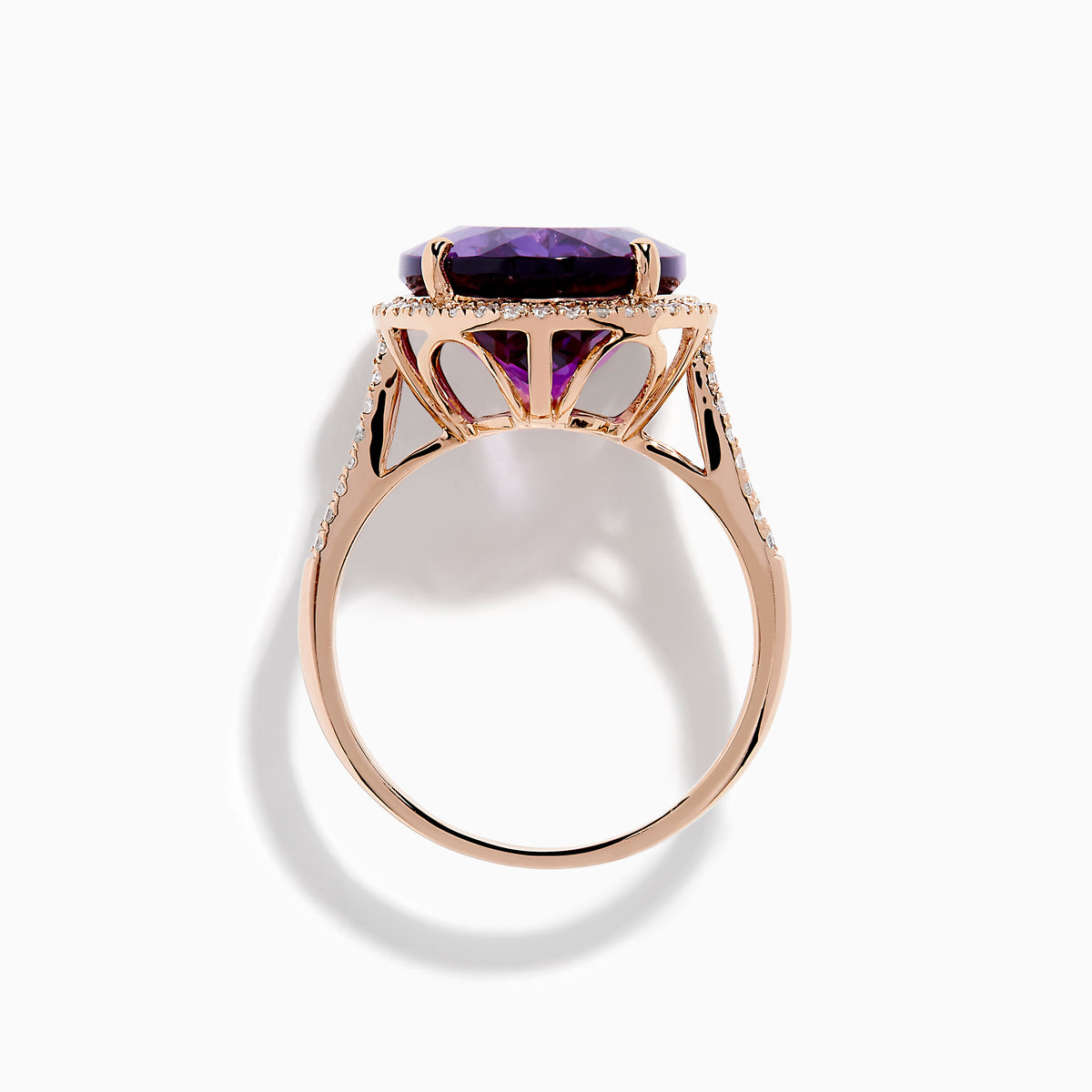 The 14K Rose Gold Amethyst and Diamond Ring showcases an oval amethyst with a diamond halo set on a rose gold band, displayed against a plain white background.