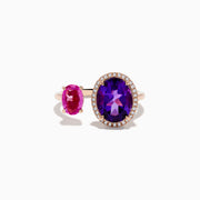 The 14K Rose Gold Amethyst, Pink Sapphire, and Diamond Toi Et Moi Ring features a large oval amethyst with diamond accents and a smaller oval pink sapphire set on a delicate band.