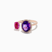 The 14K Rose Gold Amethyst, Pink Sapphire, and Diamond Toi Et Moi Ring features a large oval amethyst with diamond accents and a smaller oval pink sapphire set on a delicate band.