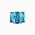 A striking 14K White Gold Blue Topaz and Diamond Statement Ring featuring seven large rectangular blue topaz stones arranged vertically, accented with diamonds—an elegant and eye-catching design.