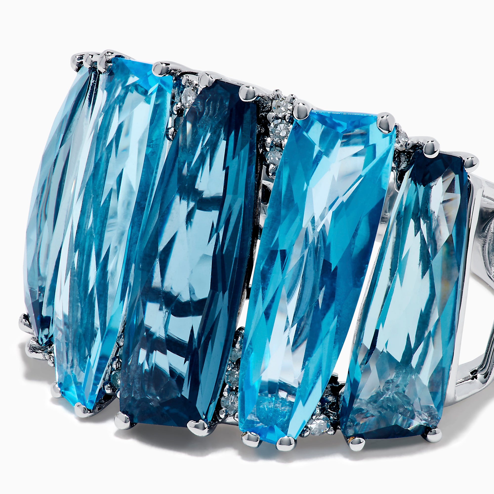 A striking 14K White Gold Blue Topaz and Diamond Statement Ring featuring seven large rectangular blue topaz stones arranged vertically, accented with diamonds—an elegant and eye-catching design.